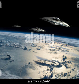 A small fleet of flying saucers take position in orbit over Earth. Stock Photo