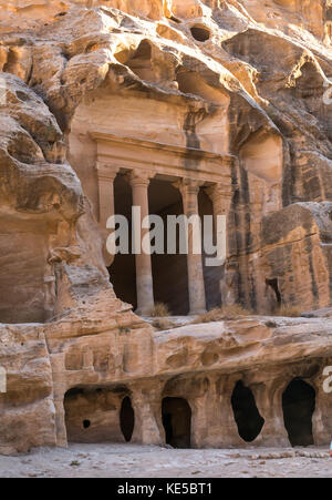 Nabataean Triclinium ruin carved in red sandstone cliff, Little Petra gorge, Siq al-Barid, archaeological site, Wadi Musa, Jordan, Middle East Stock Photo