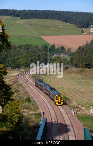 The 1011 Edinburgh - Tweedbank Scotrail train approaches  Bowshank tunnel, between Stow & Galashiels on the Borders railway line Stock Photo