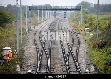 Railway workers on the un-electrified part of the Great Western mainline railway at Steventon, Oxfordshire, where a Grade II-listed bridge over the B4017 is preventing full electrification of the line as it is too low. Stock Photo