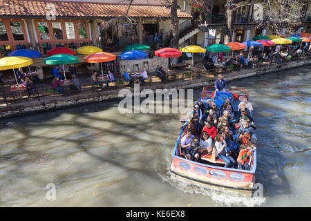 January 3, 2016 San Antonio, Texas: tourits enjoying a ride on the San Antonia river on one of the many river cruises Stock Photo