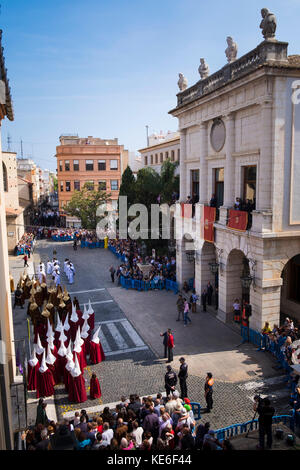 Resurrection Parade on Easter Sunday in Gandia Spain with the brotherhoods in their colourful outfits with pointed hats Stock Photo