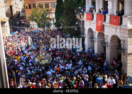 Easter Sunday Resurrection Procession, the meeting of Jesus with Virgin Mary in front of the penitents in their colourful outfits and pointed hats. Stock Photo