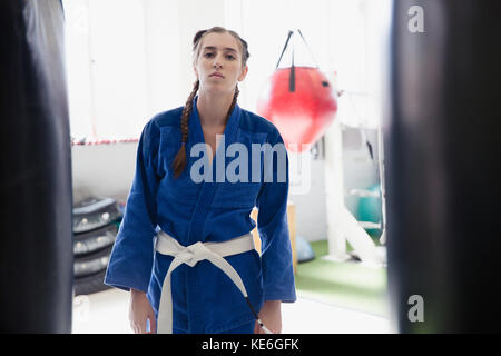 Portrait confident, tough young woman wearing judo uniform Stock Photo