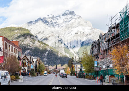 BANFF, CANADA - OCT 16, 2017: Busy Banff Avenue in the Banff National Park with Cascade Mountain in the background. The townsite is a major Canadian t Stock Photo