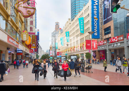 SHANGHAI, CHINA - DEC 28, 2016: People walking on Nanjiing road in Downtown of Shanghai. The area is the main shopping district of the city and one of Stock Photo