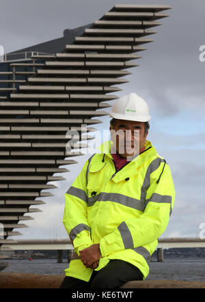 Japanese architect Kengo Kuma views the river facing front of the V&A Museum of Design in Dundee which juts out into the River Tay. Stock Photo