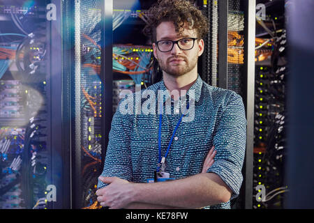 Portrait confident male IT technician in server room Stock Photo