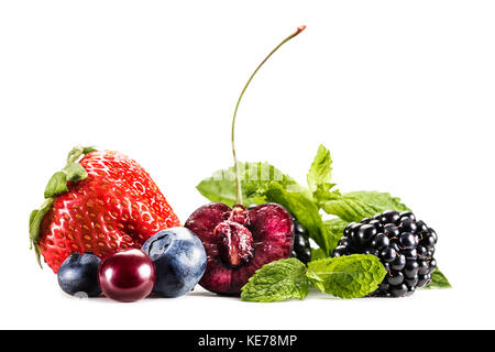 assorted berries and mint leaves Stock Photo