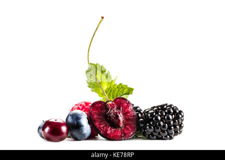 assorted berries and mint leaves Stock Photo