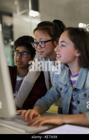 Students using computer in classroom Stock Photo