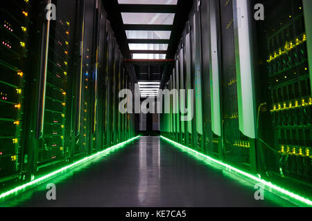 Glowing panels in dark server room Stock Photo
