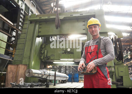 Portrait confident male worker working in steel factory Stock Photo