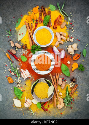 Various of spices and herbs in ceramic bowl. Flat lay of spices ingredients chilli ,pepper corn, garlic, thyme, oregano, cinnamon, star anise, nutmeg, Stock Photo
