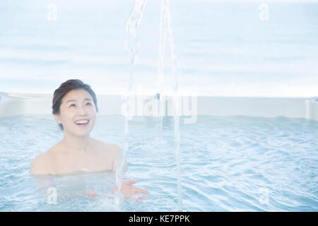 Portrait of smiling middle aged woman at spa Stock Photo