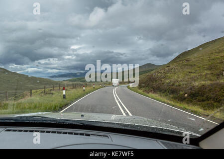 Driving in the rain on the A87 north of Loch Ainort, Isle of Skye, Highland, Scotland, UK Stock Photo