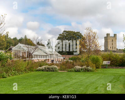 Helmsley Castle overlooking the Helmsley Walled Garden with a show of autumn flowers Stock Photo