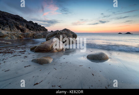 Dusk over the beach at Porth Nanven on the Cornish coast Stock Photo