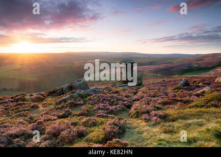 Stunning sunset over the Salt Cellar on Derwent Edge in the Derbyshire Peak District Stock Photo