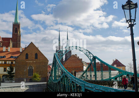 Tumski Bridge And Lovers Locks With Spires Of Cathedral In The Background; Wroclaw, Lower Silesia, Poland Stock Photo