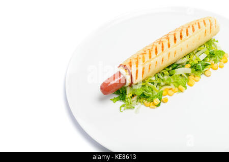 Appetizing hot dog on green gourmet isolated on white Stock Photo