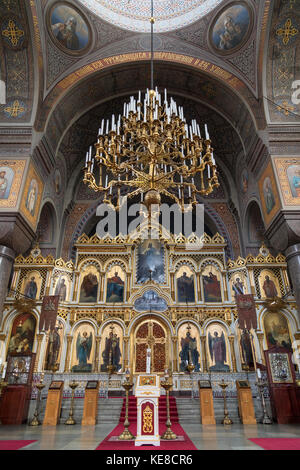 The iconostasis in Uspenski Cathedral in the city of Helsinki in Finland. The Cathedral is on a hillside on the Katajanokka peninsula overlooking Hels Stock Photo
