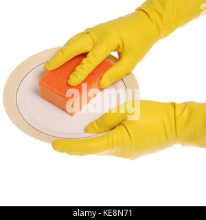 Yellow gloved hands washing a plate with a orange sponge. On white background. Clipping path included. Stock Photo