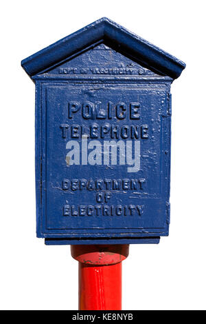 Vintage blue police call box on red pole. Isolated. Stock Photo