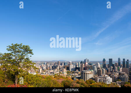 Montreal, Canada - 18 October 2017: Montreal Skyline with Autumn foliage from Mont Royal Kondiaronk Belvedere Stock Photo