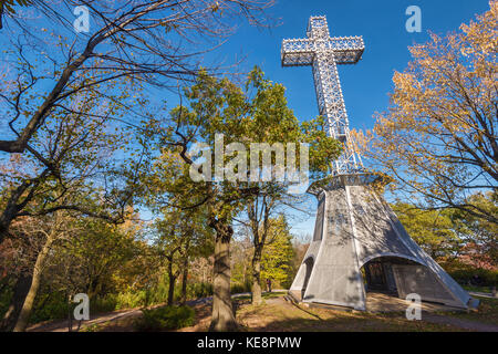 Montreal, Canada - 18 October 2017: Montreal Mont-Royal Cross with fall foliage colours Stock Photo