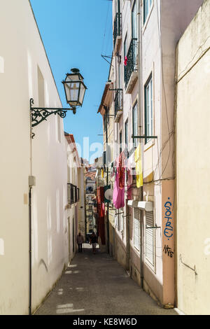 LISBON, PORTUGAL - AUGUST 12, 2017: Tourists Exploring The Old Streets Of Lisbon City in Portugal. Stock Photo