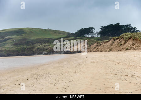 Daymer Bay is a popular tourist destination on the north Cornish coastline opposite the busy fishing harbour at Padstow Stock Photo