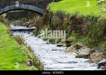 River flowing through the pretty village of Boscastle towards the sea. The River Valency has previously caused flooding disasters in the village. Stock Photo