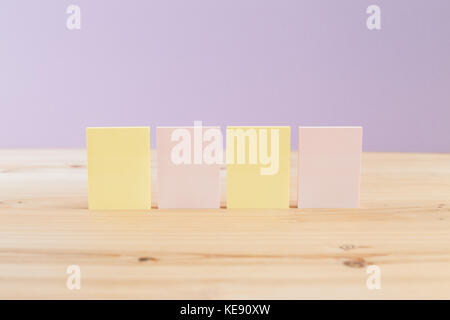 color blank sticky notes (post it) on wooden desk Stock Photo