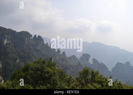 Rock formations around Wulingyuan Scenic Area. What a dramatic landscape! Pic was taken in Zhangjiajie, September 2017. Stock Photo