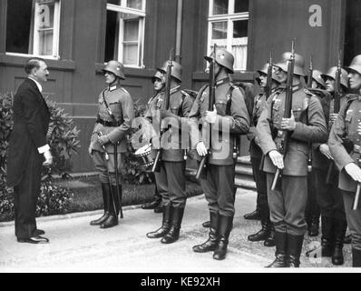 The Reich Chancellor and National Socialist leader Adolf Hitler greets the guard after diplomatic reception in September 1934. | usage worldwide Stock Photo