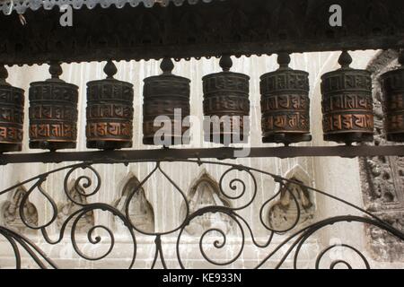 Noemie Repetto / Le Pictorium -  Nepal - Kathmandu. Swayambhumath Temple, also known as the Monkey Temple. -  20/09/2017  -  Nepal / Kathmandu / Kathmandu  -  Nepal - Kathmandu. The temple of Swayambhumath or the Monkey Temple. The pilgrims perform a circumanbulation by circling the stupa by ringing a bell and praying approximately every quarter of a turn. In passing, they pass their hand on the upper part to turn these kinds of tops. Stock Photo