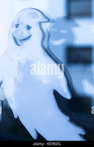 Halloween chidren's party toy ghost levitating flying in the air. Stock Photo