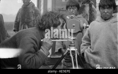 Assaajug using movie camera Inuit Pangnirtung Nunavut 1929 Stock Photo ...