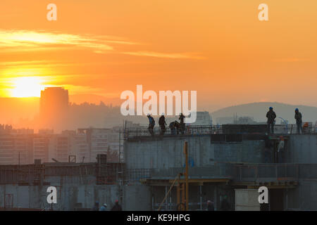 Santiago, Las Condes district, Chile - Workers on a real estate development in Las Condes district, one of the wealthiest and booming Stock Photo