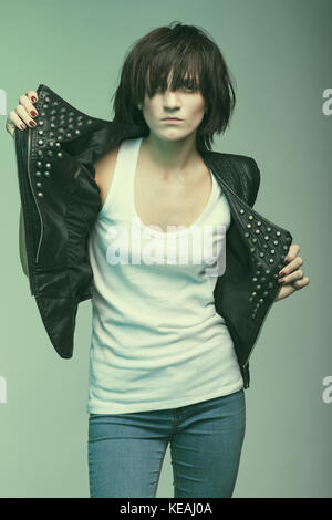 Androgyny female model in Heroin chic style. Old style tinted image Stock Photo