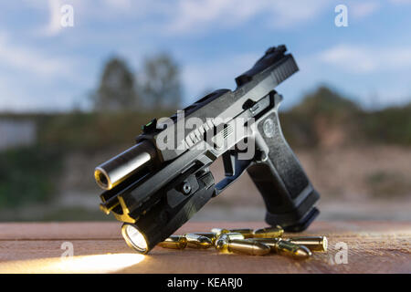 Pistol SigSauer P320 X-Five & flashlight Foxtrot 1 Stock Photo