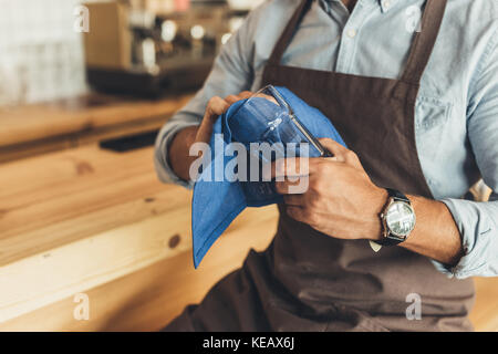 worker cleaning glassware Stock Photo