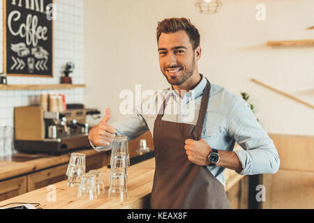 barista standing at counter Stock Photo