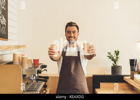 barista showing coffee to go Stock Photo