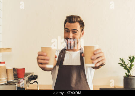 barista showing coffee to go Stock Photo