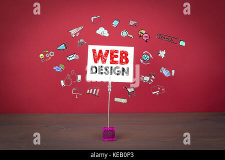 web design concept. Wooden table at the red background Stock Photo