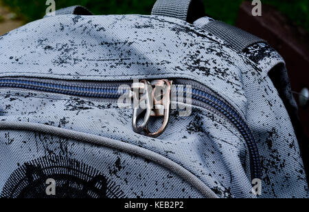 zip on small gray black bag, backpack for school Stock Photo