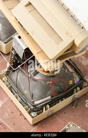 Old broken computers and CRT PC computer monitors (screens) Stock Photo
