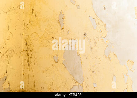 Wall with stripped paint in abandoned house Stock Photo